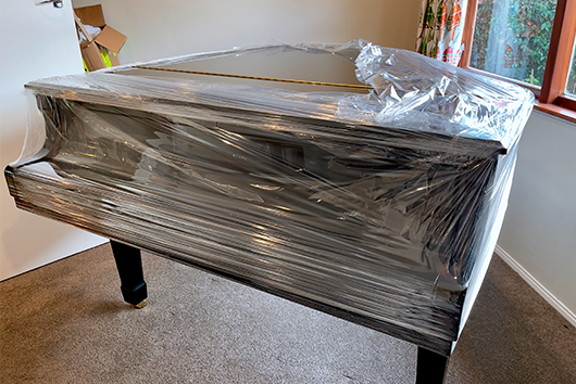 Piano wrapped for moving relocation